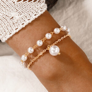 Gold plated pearl studded dual strand bracelet
